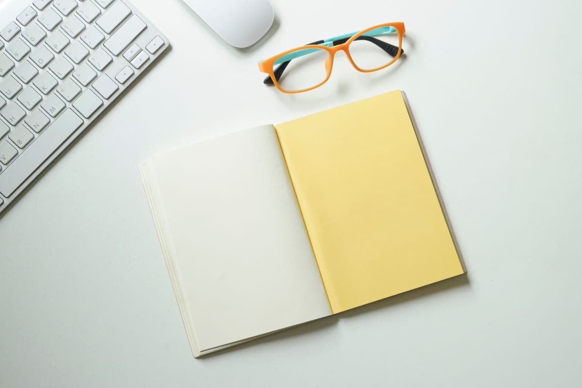 A large open notebook on a desk