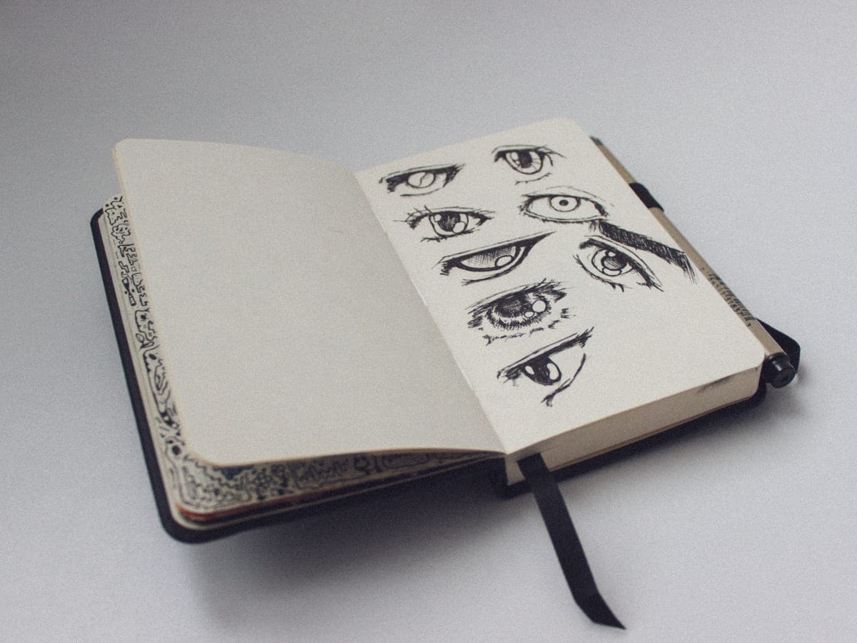 An ink drawing in progress in a sketchbook