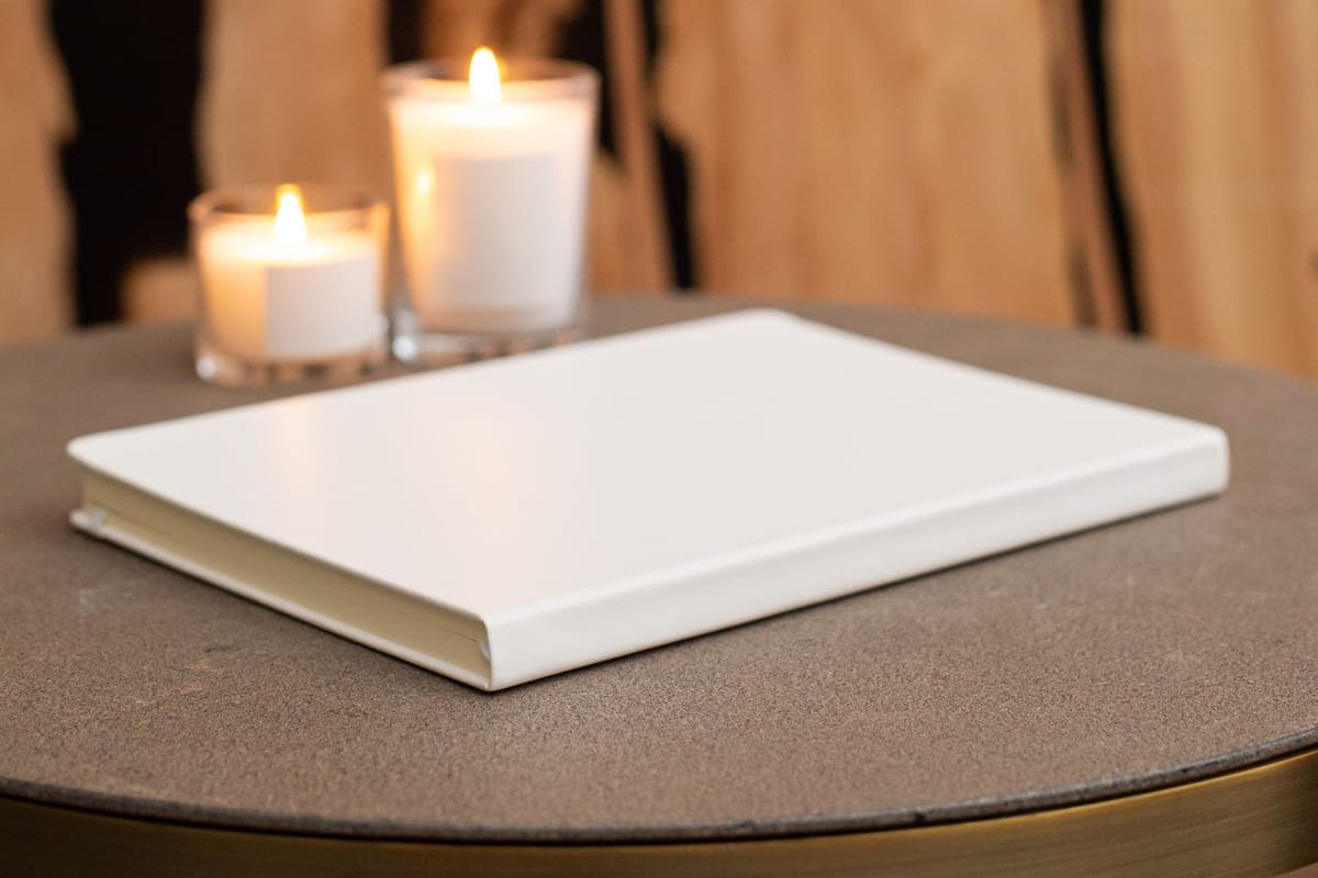 A closed hardcover journal resting on a table