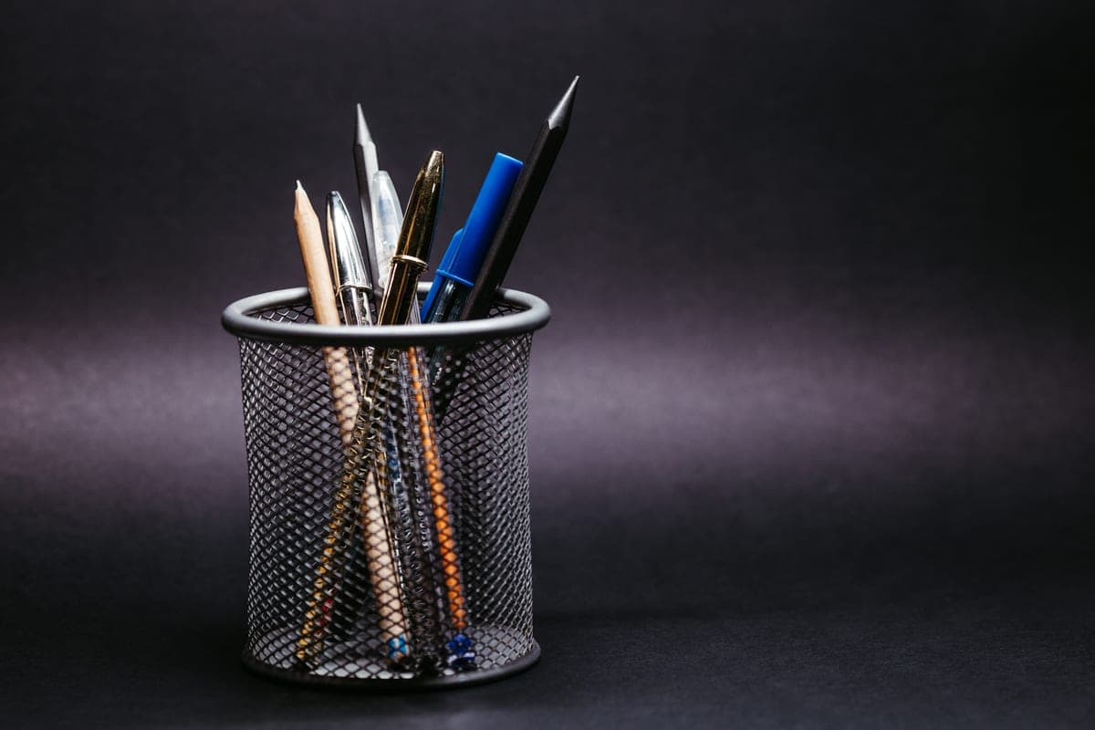 A metal-trimmed pen on a dark surface