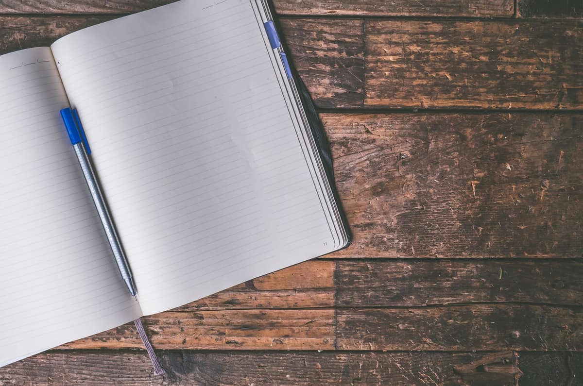 An open notebook lying flat on a table