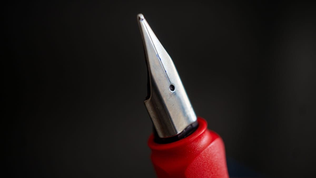 A macro photograph of a fountain pen nib tip