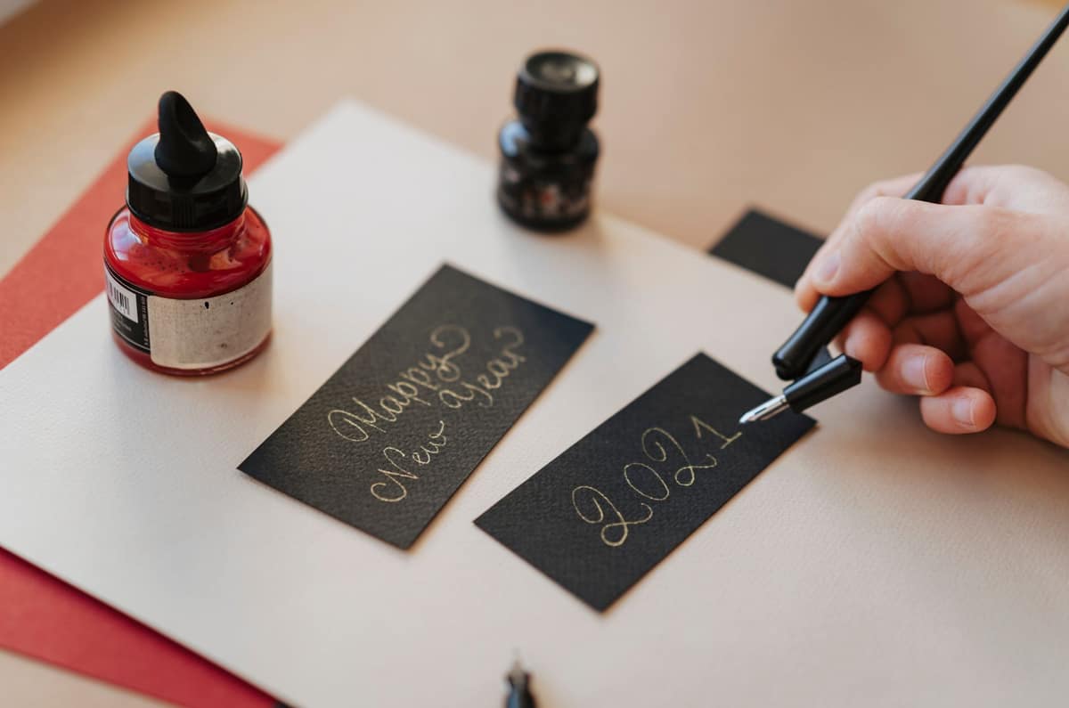 Red fountain pen ink written on a notebook page
