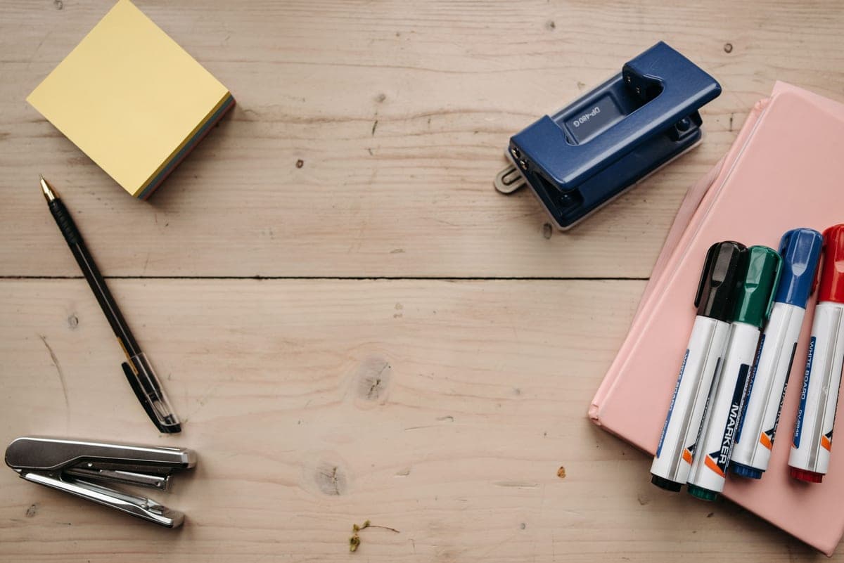 A stationery set arranged on a desk