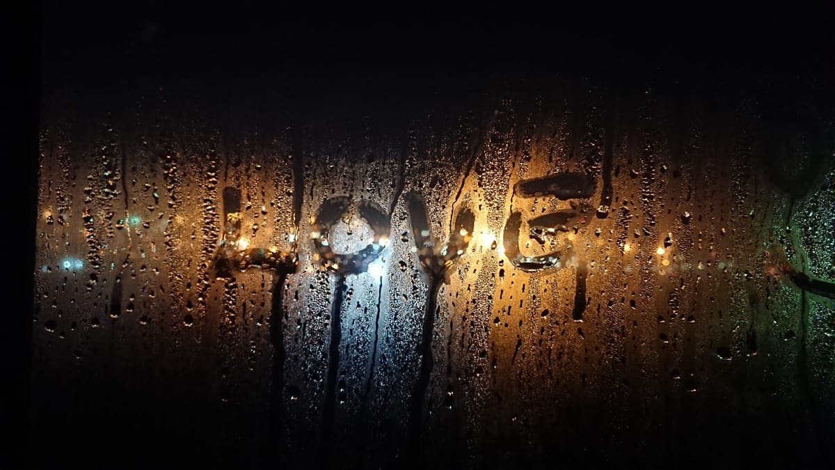 Water droplets resting on a written page